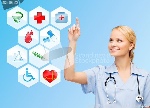 Image of smiling doctor over medical icons blue background