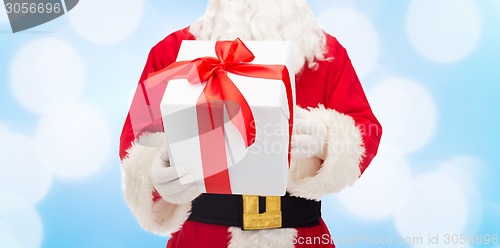 Image of close up of santa claus with gift box