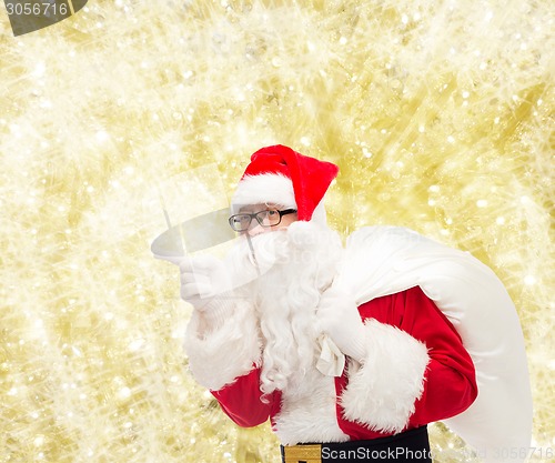 Image of man in costume of santa claus with bag