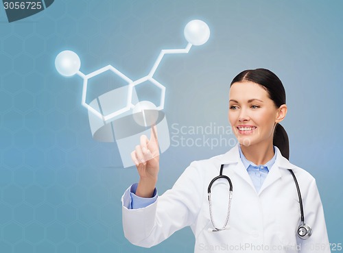 Image of smiling female doctor pointing to molecule