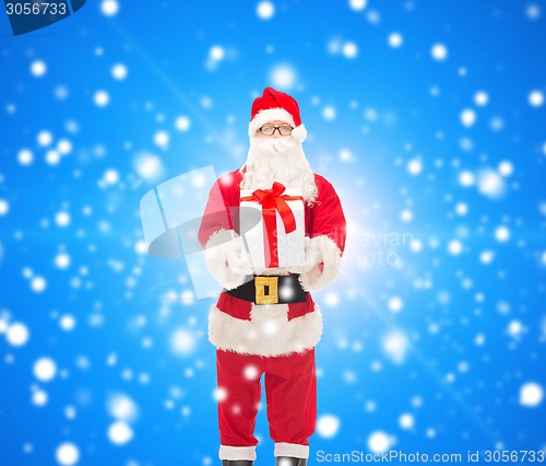 Image of man in costume of santa claus with gift box