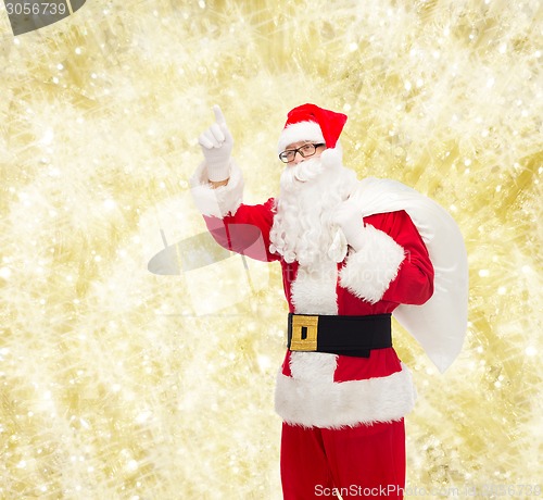 Image of man in costume of santa claus with bag