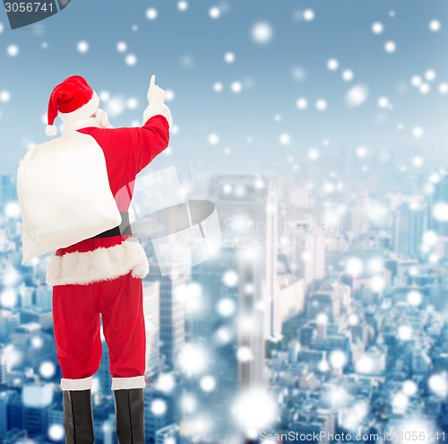 Image of man in costume of santa claus with bag