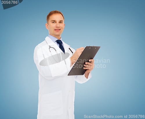 Image of smiling male doctor with clipboard and stethoscope