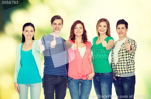 Image of group of smiling students showing thumbs up