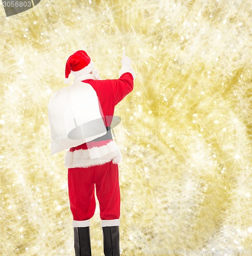 Image of man in costume of santa claus with bag