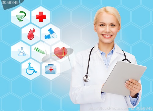 Image of smiling doctor with tablet pc and medical symbols