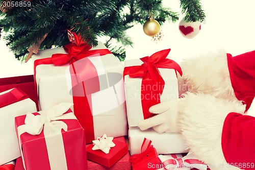 Image of close up of santa claus with presents