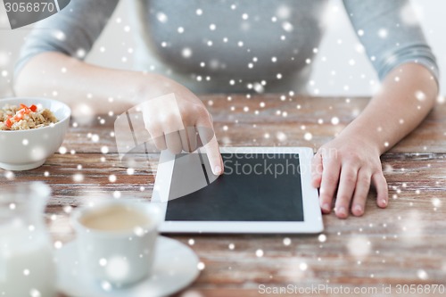 Image of woman pointing finger to tablet pc computer