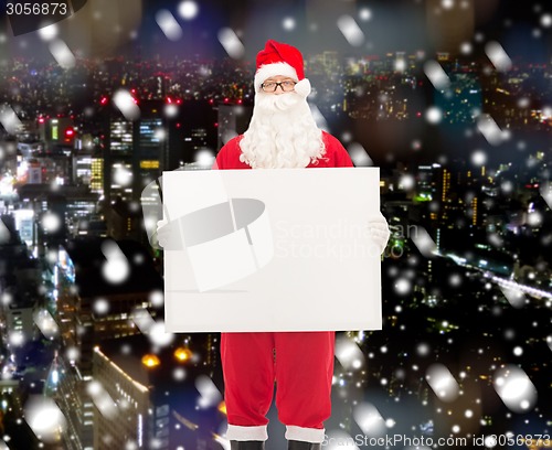 Image of man in costume of santa claus with billboard