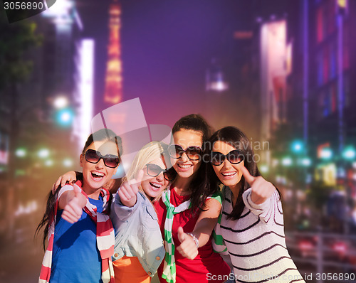 Image of teenage girls or young women showing thumbs up