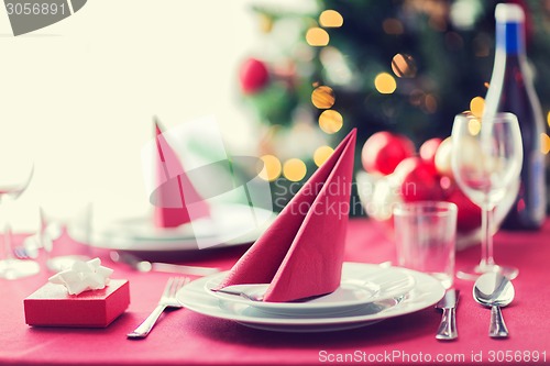 Image of room with christmas tree and decorated table