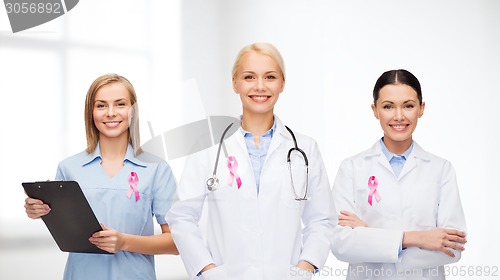 Image of female doctors with breast cancer awareness ribbon