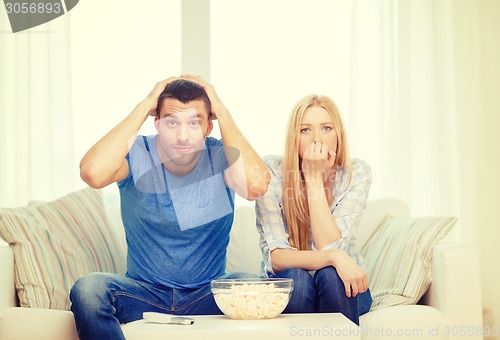 Image of upset couple after sports team loss