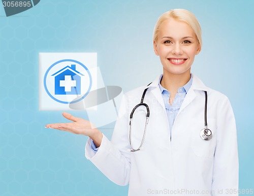 Image of smiling doctor or nurse pointing to pills icon