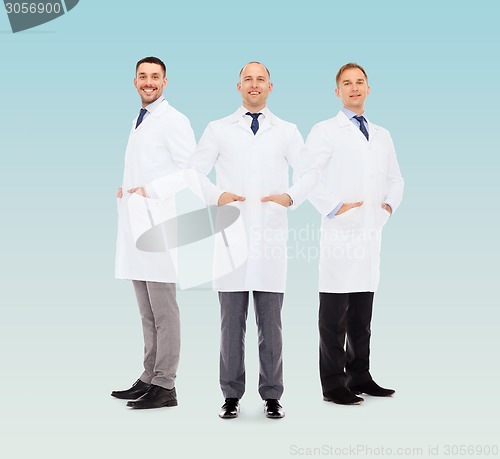 Image of smiling male doctors in white coats