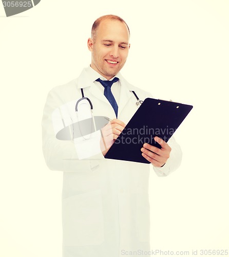 Image of smiling male doctor with clipboard and stethoscope