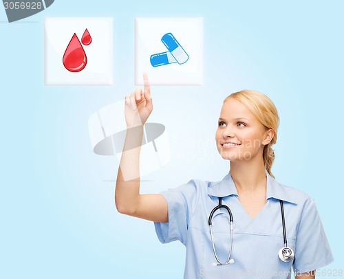 Image of smiling doctor or nurse pointing to pills icon