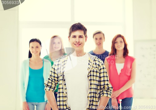 Image of smiling male student with group of classmates