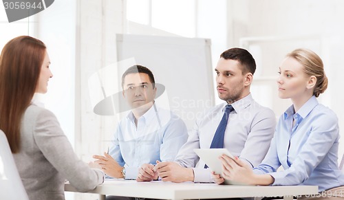 Image of business team interviewing applicant in office
