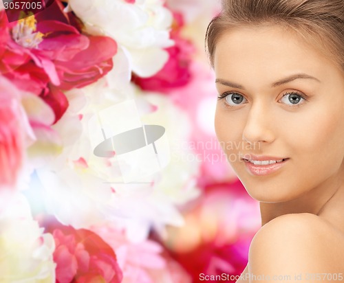 Image of beautiful young woman with bare shoulders