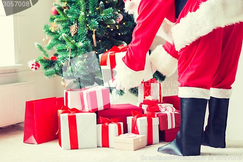 Image of close up of santa claus with presents