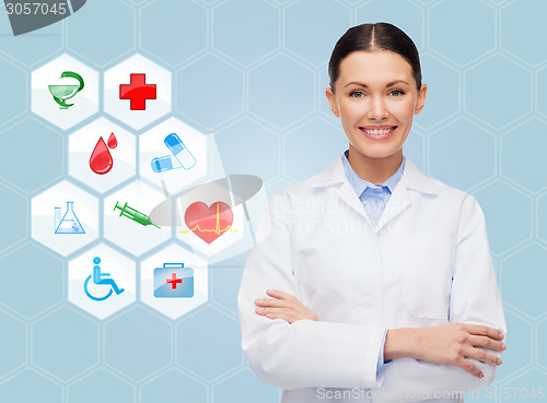 Image of smiling doctor over medical icons blue background