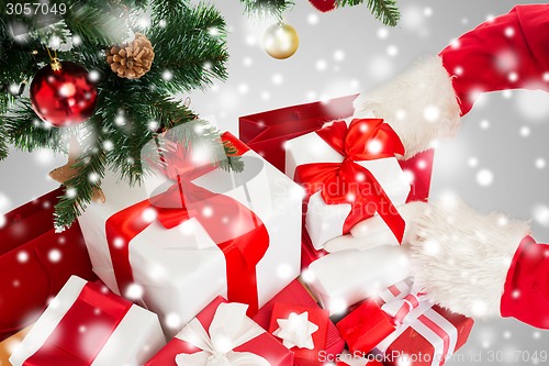 Image of close up of santa claus with presents