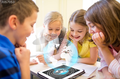 Image of group of school kids with tablet pc in classroom