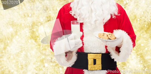 Image of santa claus with glass of milk and cookies