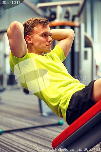 Image of man exercising in gym