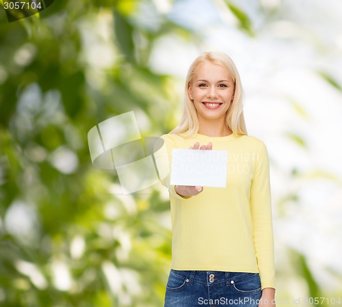 Image of smiling girl with blank business or name card