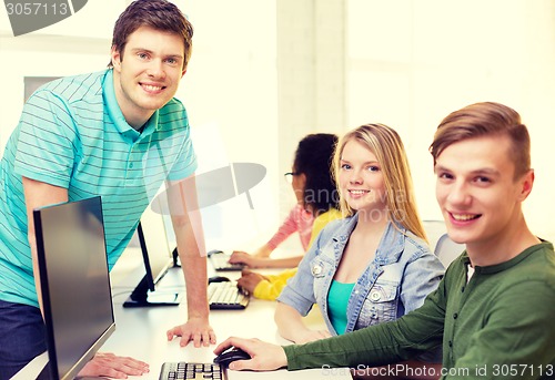 Image of group of smiling students in computer class