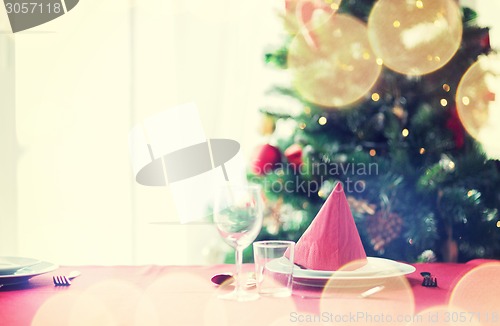 Image of room with christmas tree and decorated table