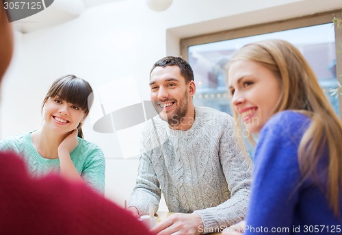 Image of group of happy friends meeting and talking