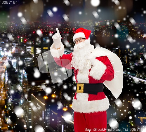 Image of man in costume of santa claus with bag