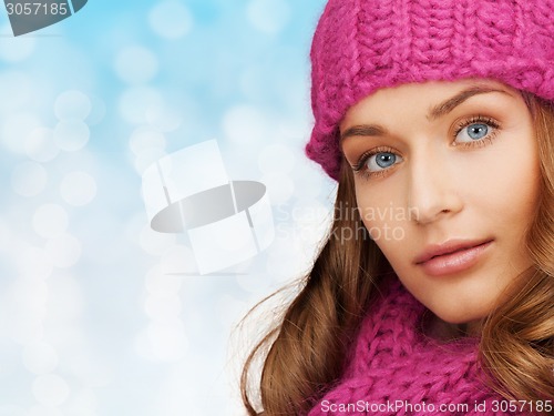 Image of close up of smiling young woman in winter clothes