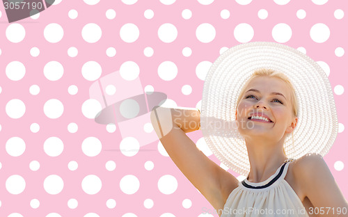 Image of beautiful smiling woman in white summer hat