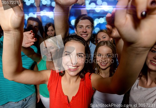 Image of smiling women dancing in club