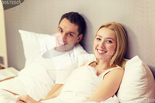 Image of happy couple sleeping in bed