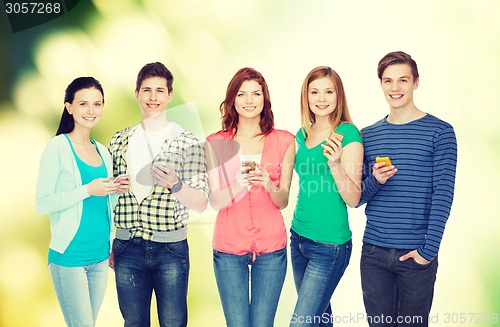 Image of smiling students with smartphones