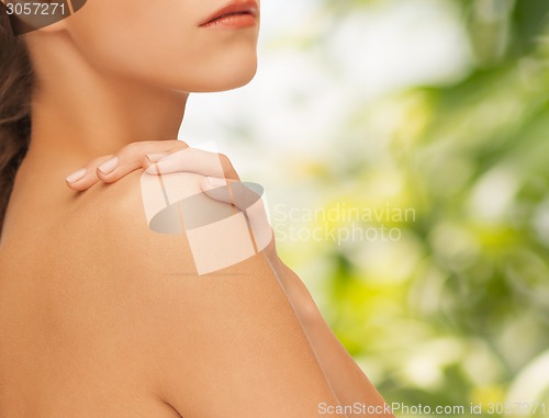Image of beautiful young woman with bare shoulders