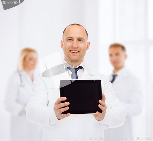 Image of smiling male doctor with tablet pc