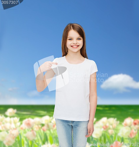 Image of smiling little girl in white blank t-shirt