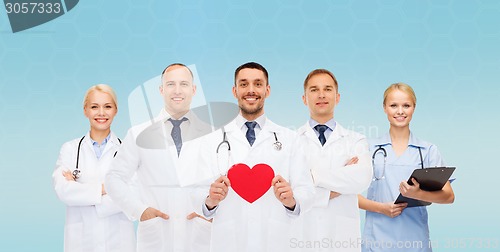 Image of group of smiling doctors with red heart shape