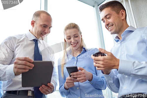 Image of business people with tablet pc and smartphones