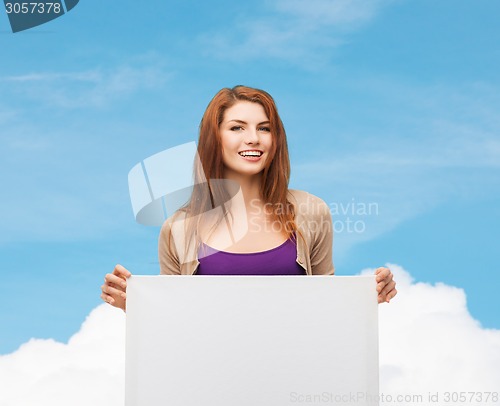 Image of smiling teenage with white board