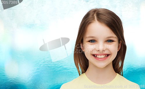 Image of smiling little girl over white background