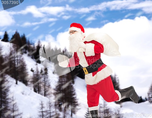 Image of man in costume of santa claus with bag