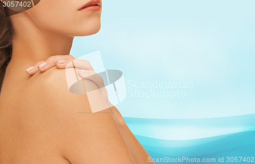 Image of beautiful young woman with bare shoulders